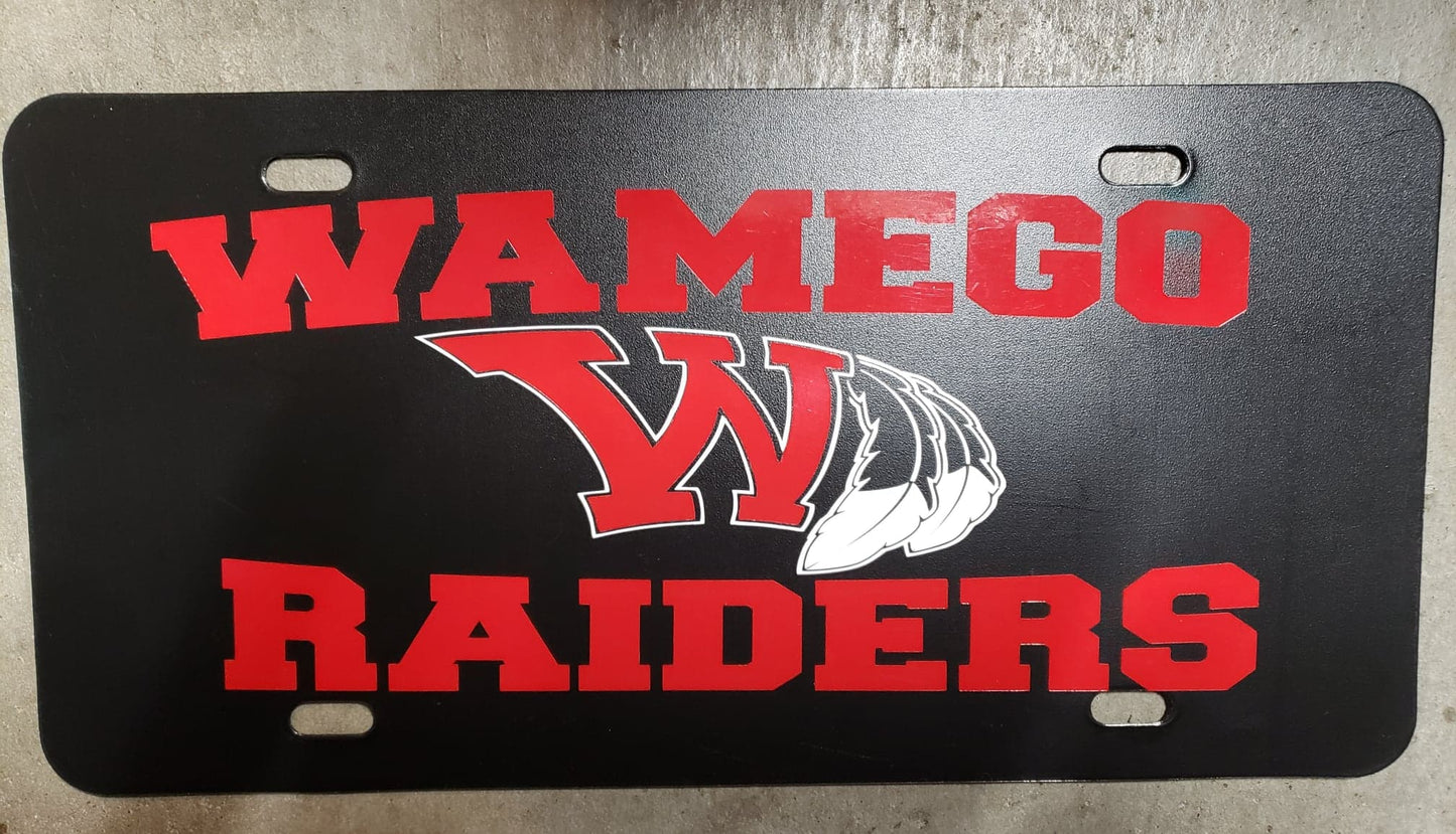 Wamego Raiders in Red Plain on a Black Plastic License Plate